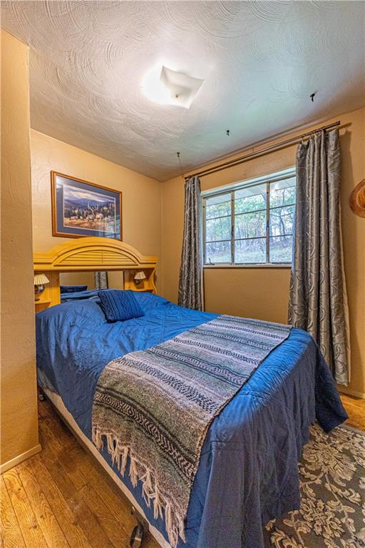 1194 Donnellville Road Natrona Heights, PA 15065 - Photo 13 of 20 a bed sitting in a bedroom next to a window