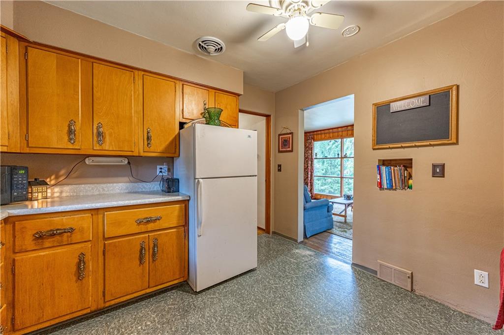 1194 Donnellville Road Natrona Heights, PA 15065 - Photo 2 of 20 a kitchen with a refrigerator and a sink