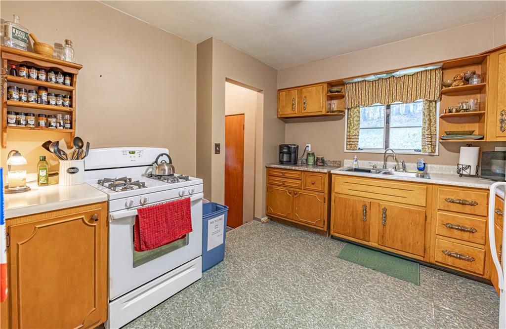 1194 Donnellville Road Natrona Heights, PA 15065 - Photo 4 of 20 a kitchen with stainless steel appliances a stove a sink and a refrigerator