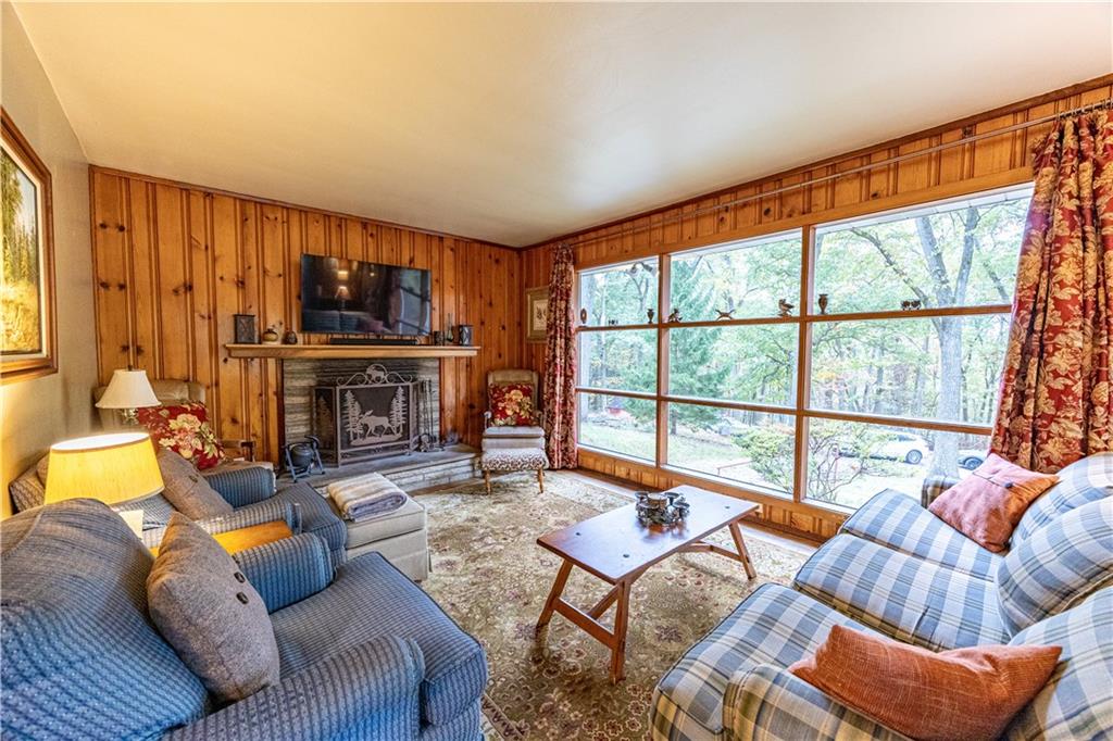 1194 Donnellville Road Natrona Heights, PA 15065 - Photo 5 of 20 a living room with furniture a large window and a fireplace