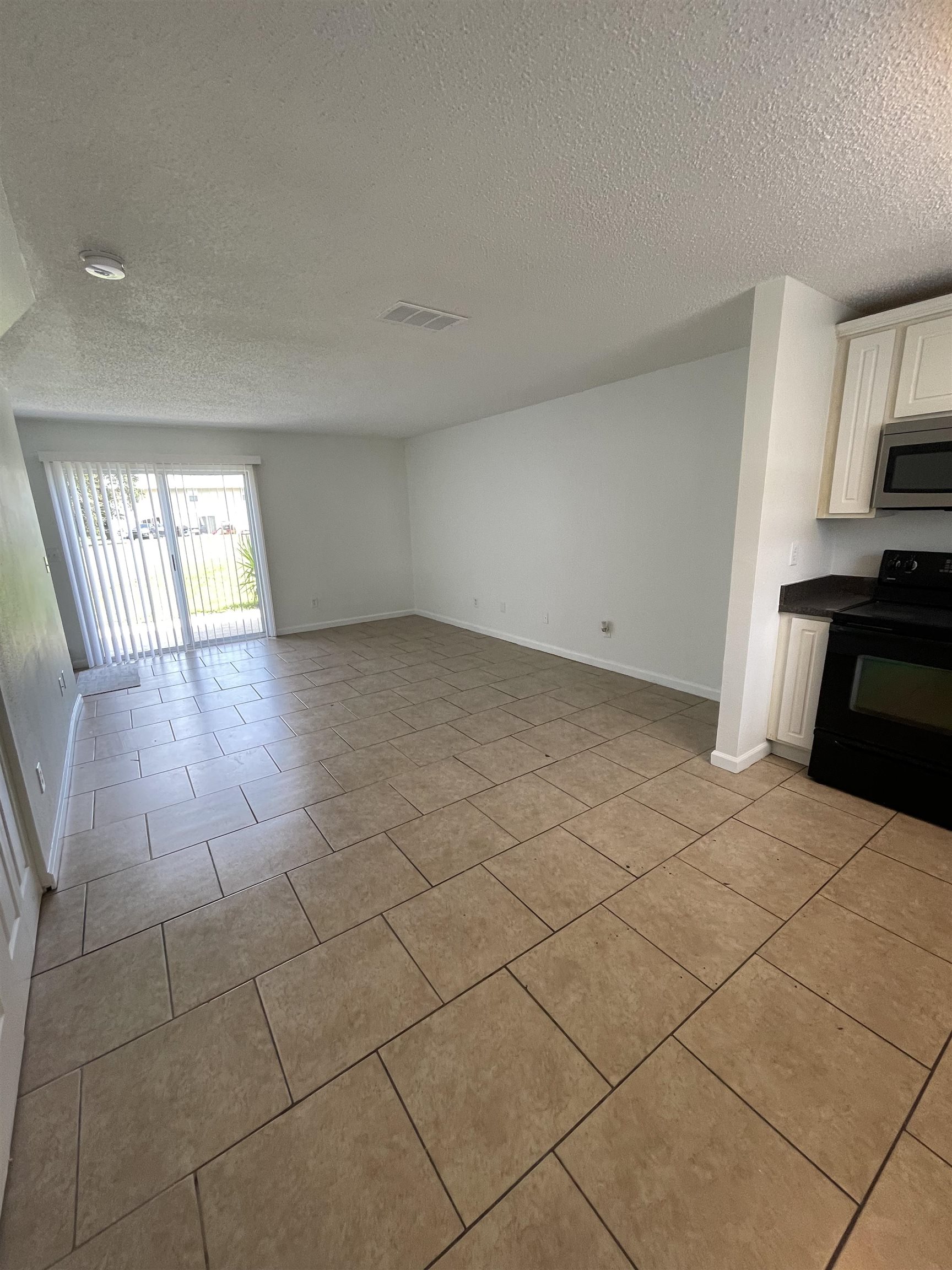 4420 Carter Road, Unit 18 St. Augustine, FL 32086 - Photo 3 of 17 a view of a livingroom with an empty space and a sink