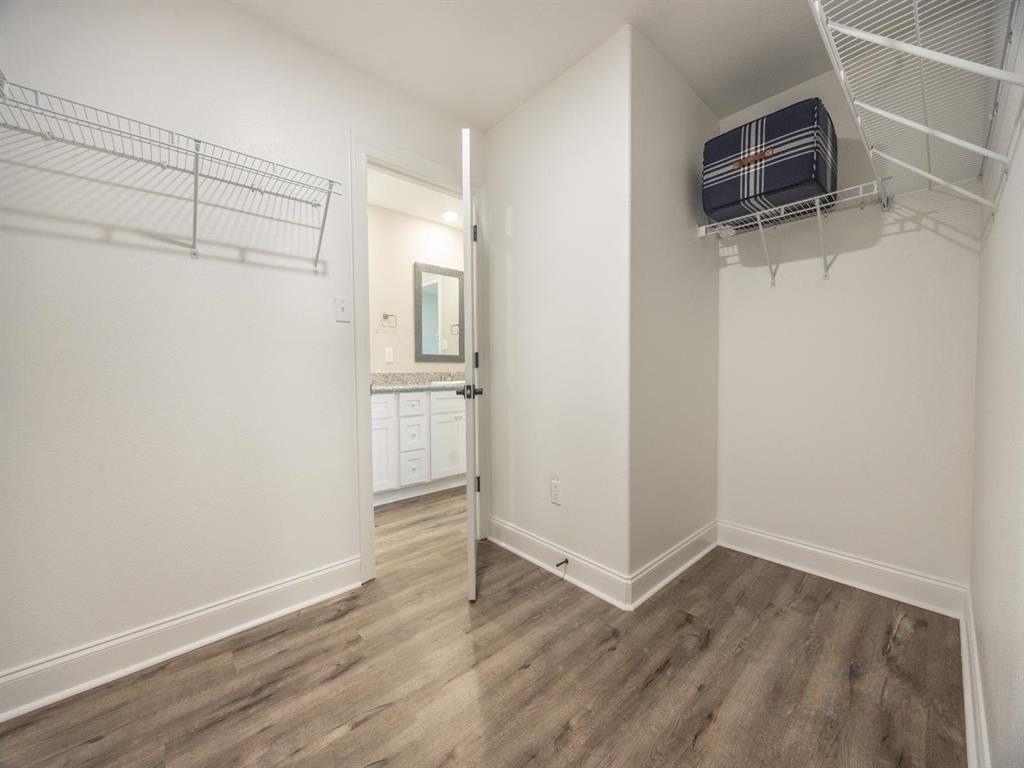 23906 Peppermint Street Elberta, AL 36530 - Photo 10 of 14 Walk in closet with dark wood finished floors