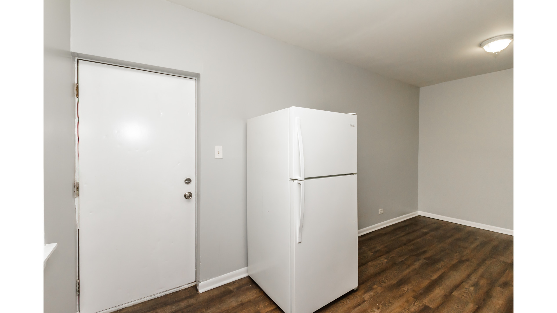 2400 North Kilbourn Avenue, Unit 2 Chicago, IL 60639 - Photo 5 of 10 a view of empty room with wooden floor