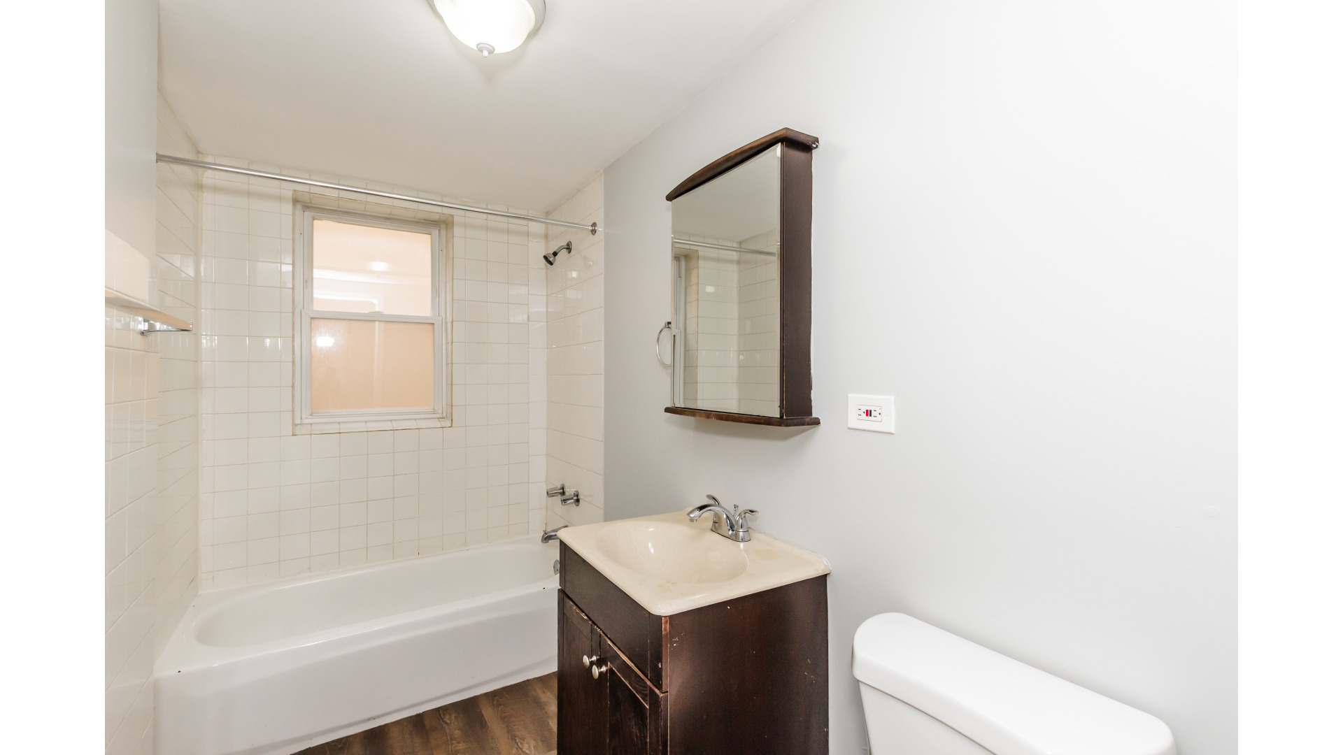 2400 North Kilbourn Avenue, Unit 2 Chicago, IL 60639 - Photo 10 of 10 a bathroom with a sink toilet vanity and bathtub