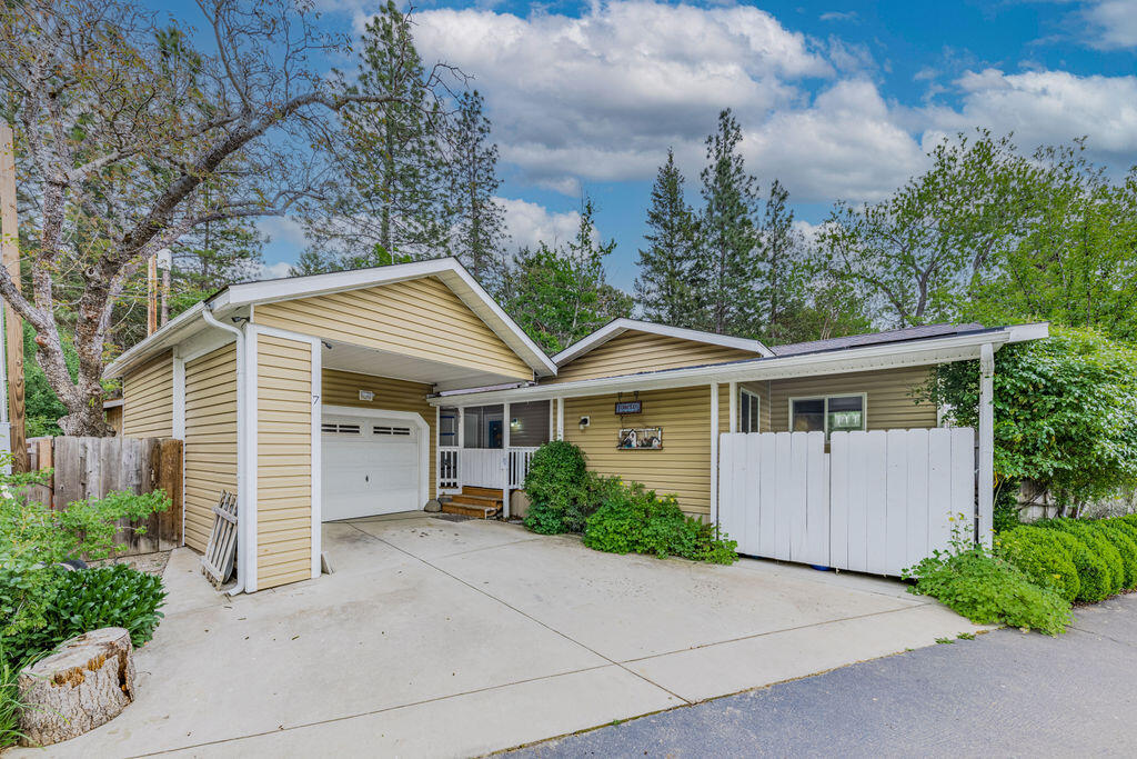 181 Upper Applegate Road, Unit 7 Jacksonville, OR 97530 - Photo 1 of 23 front view of house with a yard and trees around