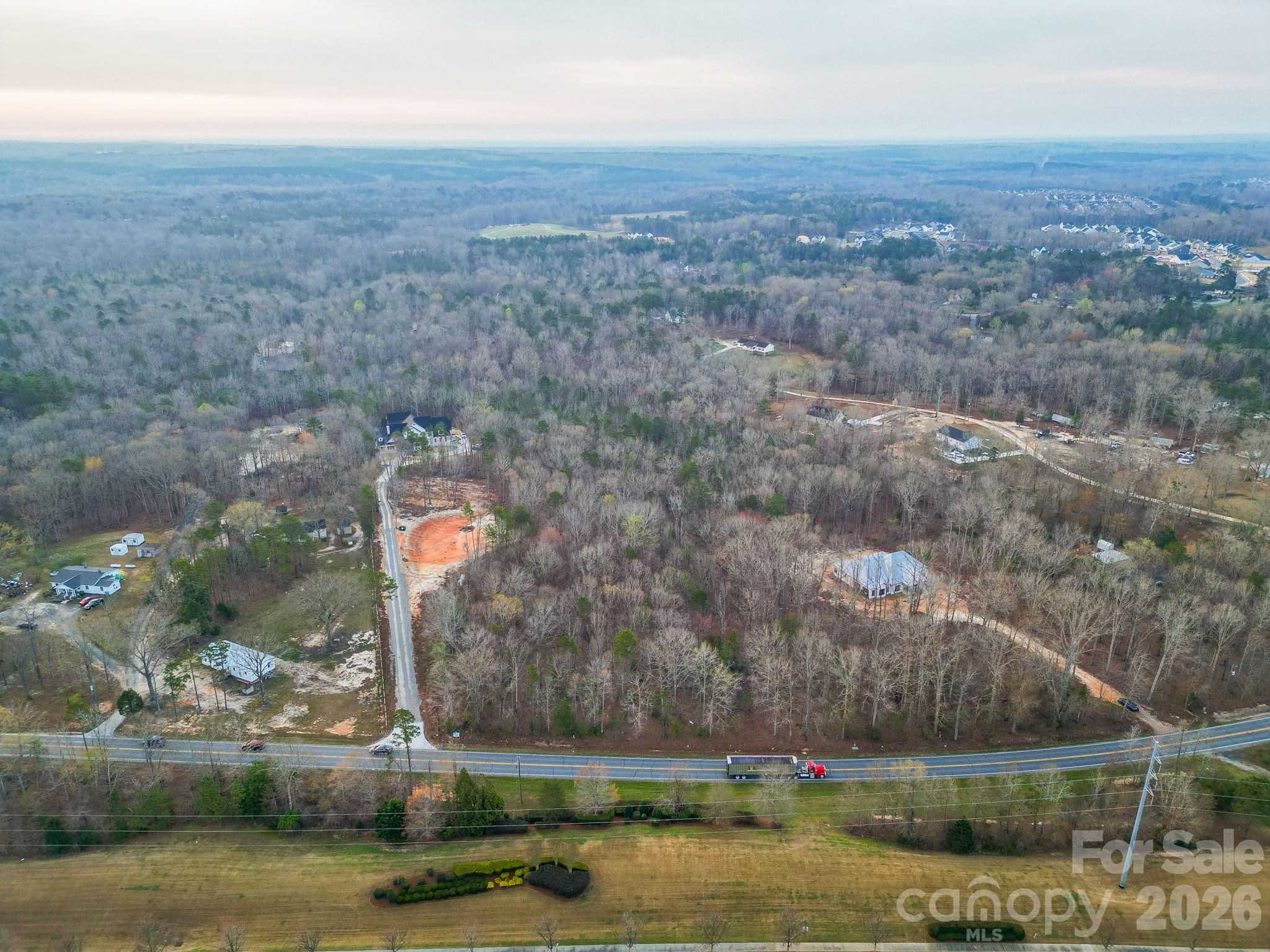 0 Van Wyck Road, Unit B Lancaster, SC 29720 - Photo 5 of 17 an aerial view of a house with a yard lake and mountain view in back