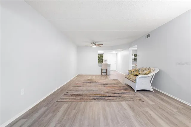 a view of wooden floor and chair in a room