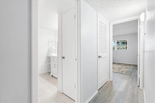 a view of a bathroom with a sink and mirror