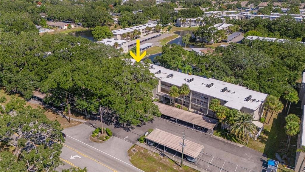 821 Patricia Avenue, Unit 202 Dunedin, FL 34698 - Photo 24 of 37 an aerial view of a house with a yard