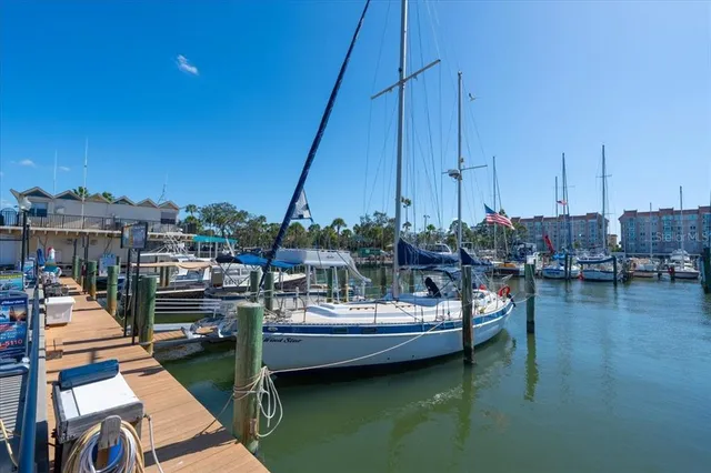 a view of a lake with boats next to a bridge