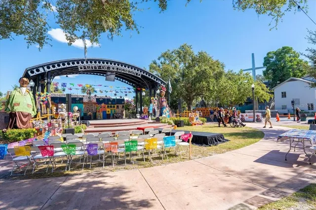 a view of a chairs and tables in a patio