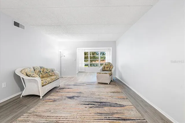 a spacious bedroom with a bed and a window