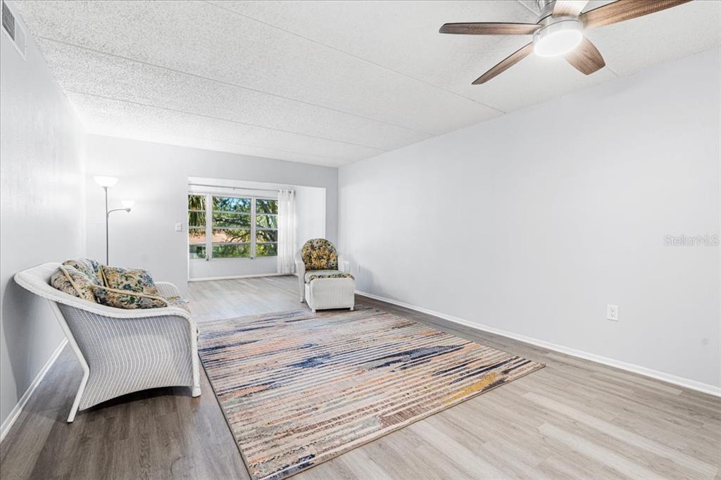 821 Patricia Avenue, Unit 202 Dunedin, FL 34698 - Photo 10 of 37 a living room with furniture and a window