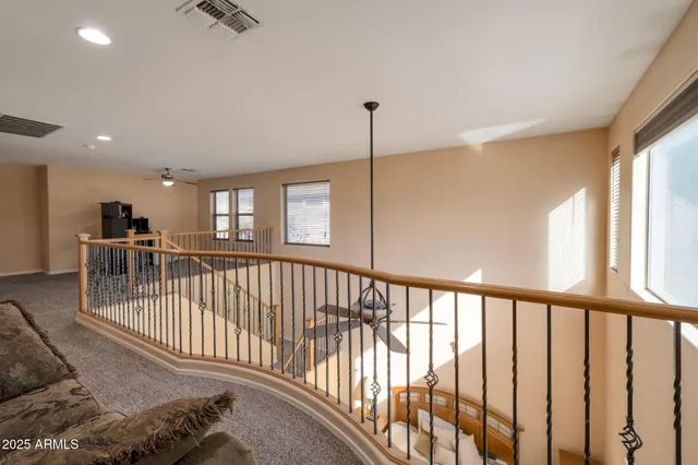 a view of a porch with wooden floor and windows
