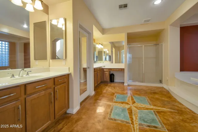 a spacious bathroom with a tub shower and sink