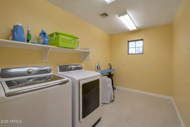 a utility room with dryer and washer