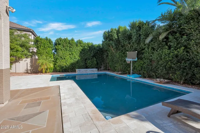 a view of a swimming pool with a yard