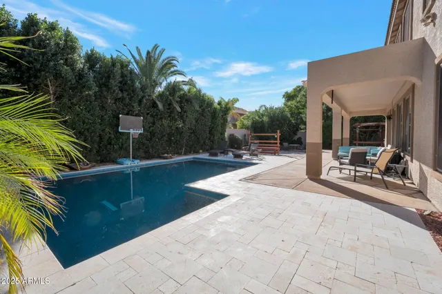 a view of a backyard with plants and a patio