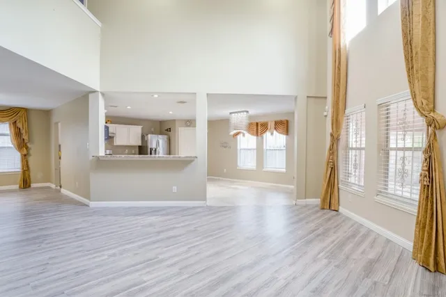 a view of a kitchen cabinets and wooden floor