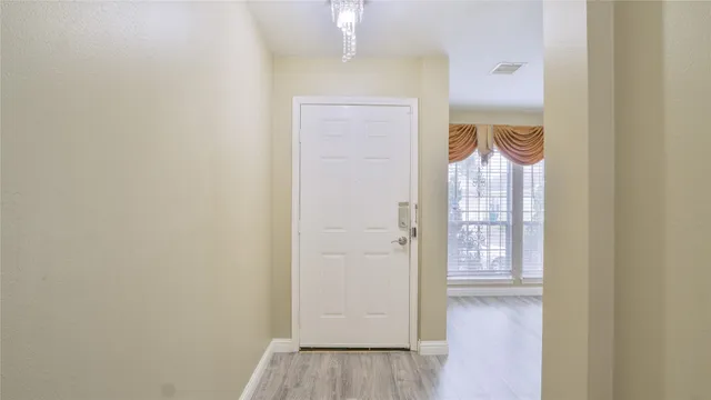 a view of a bathroom with a tub and a window