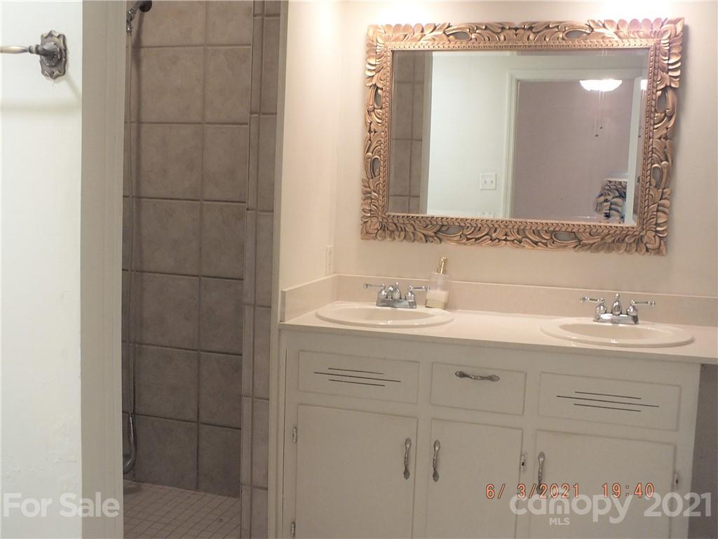 1473 Old Landsford Road Lancaster, SC 29720 - Photo 19 of 29 a bathroom with a sink and mirror