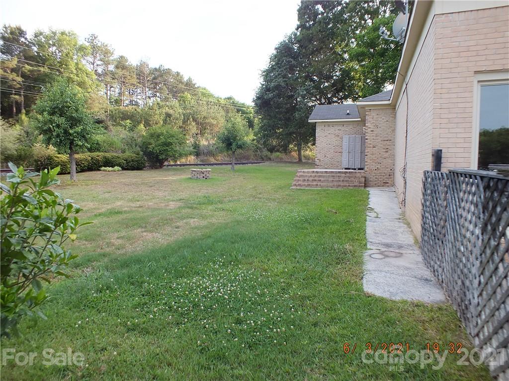 1473 Old Landsford Road Lancaster, SC 29720 - Photo 25 of 29 a view of a backyard with large trees