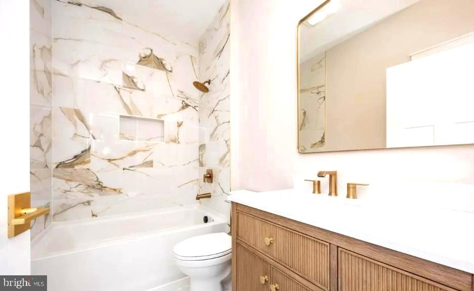 19438 Parsons Road Georgetown, DE 19947 - Photo 28 of 36 Elegant marble bath with gold accents.