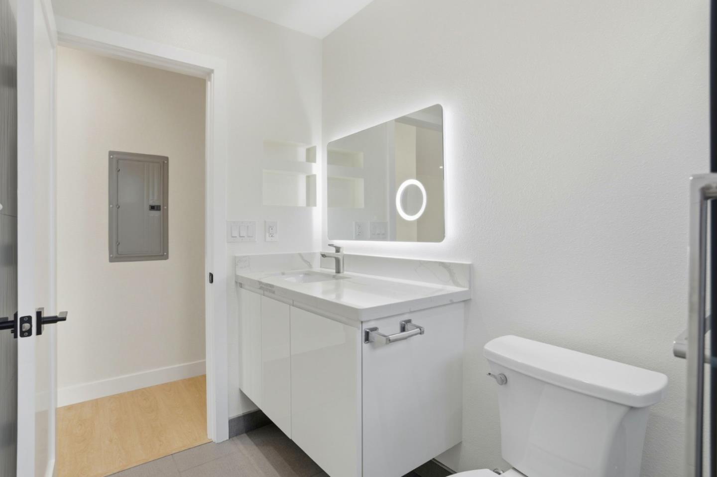 474 Oliver Street Milpitas, CA 95035 - Photo 21 of 27 a bathroom with a sink a toilet and vanity