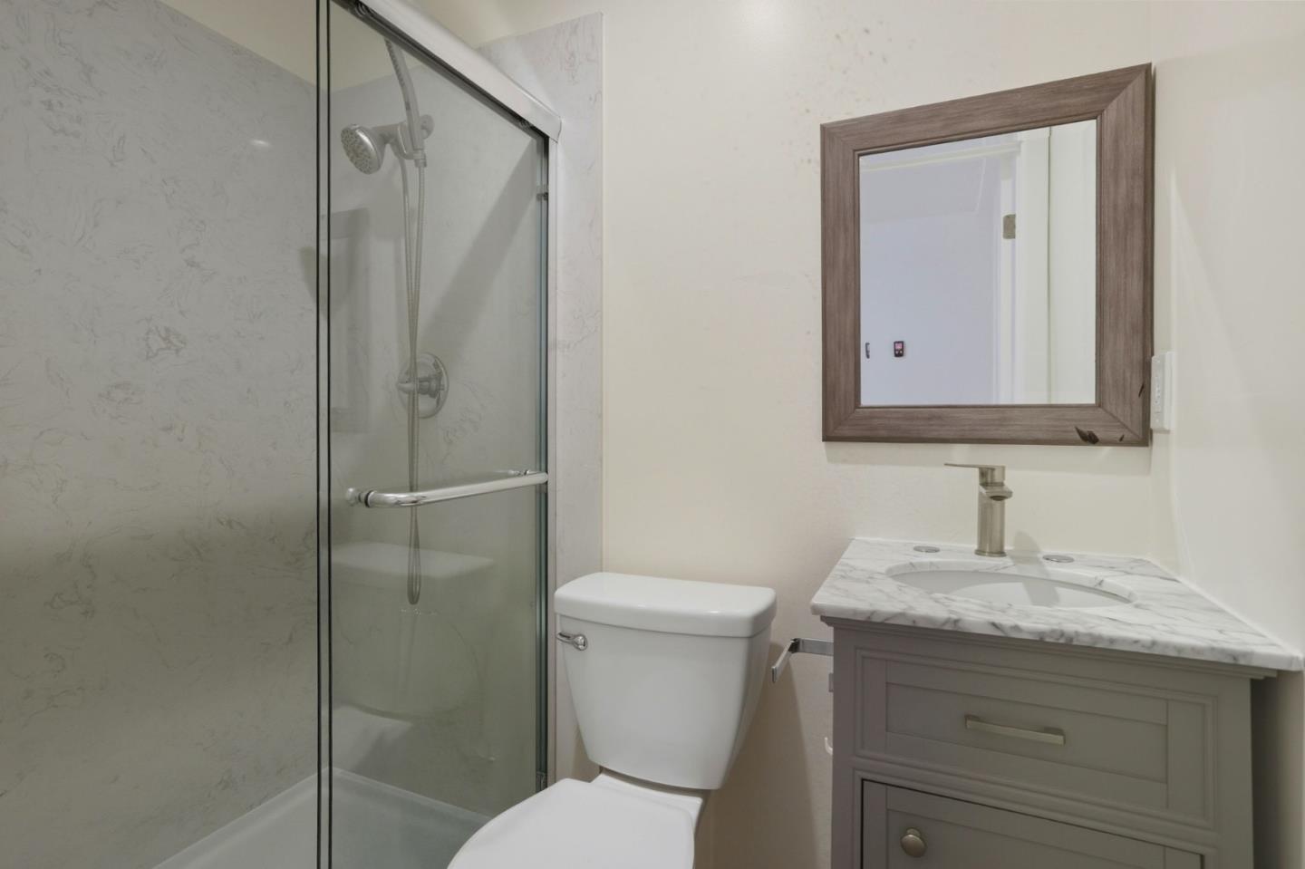 474 Oliver Street Milpitas, CA 95035 - Photo 22 of 27 a bathroom with a toilet sink vanity and shower
