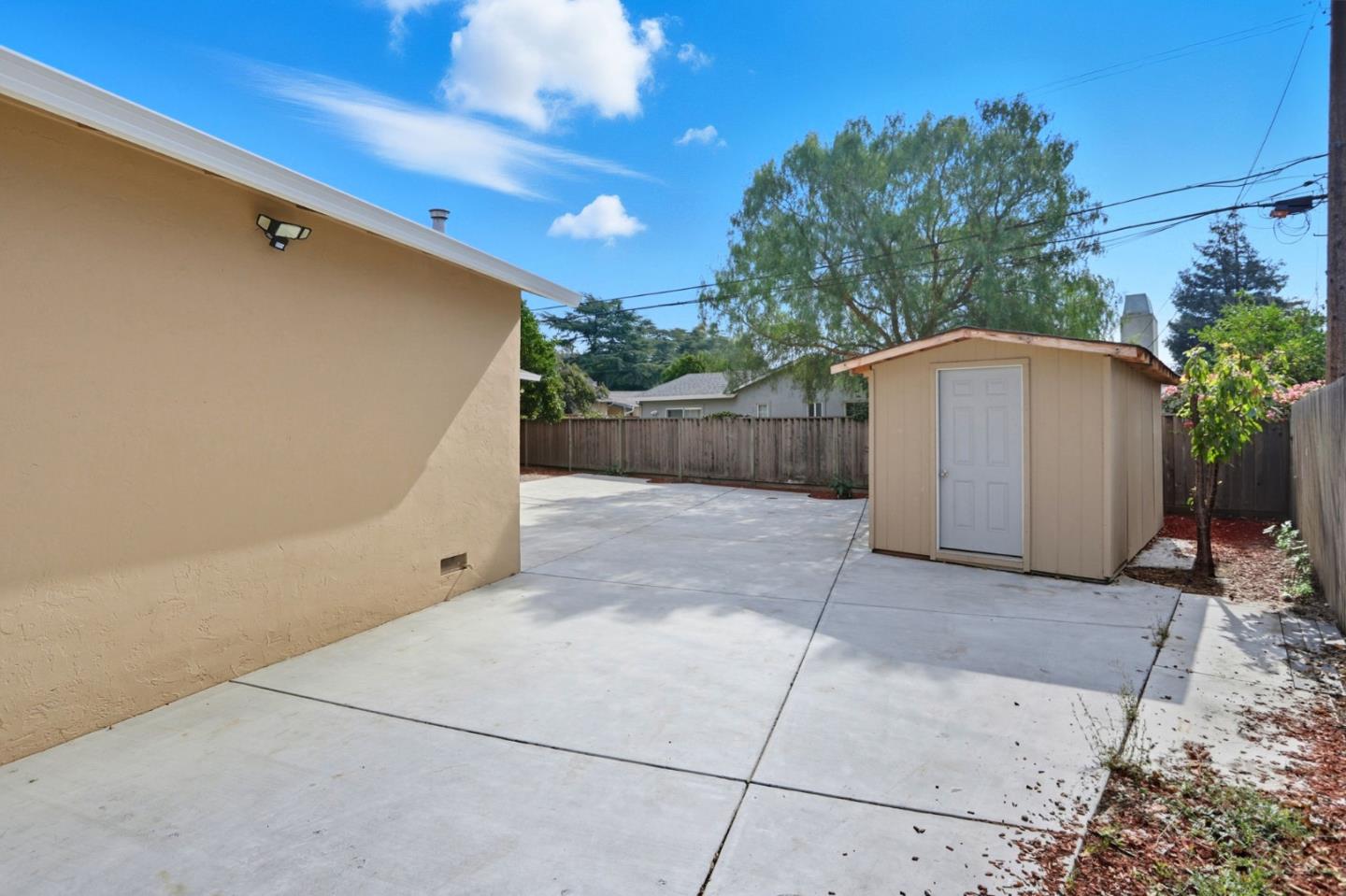 474 Oliver Street Milpitas, CA 95035 - Photo 24 of 27 a view of backyard with potted plants and wooden fence