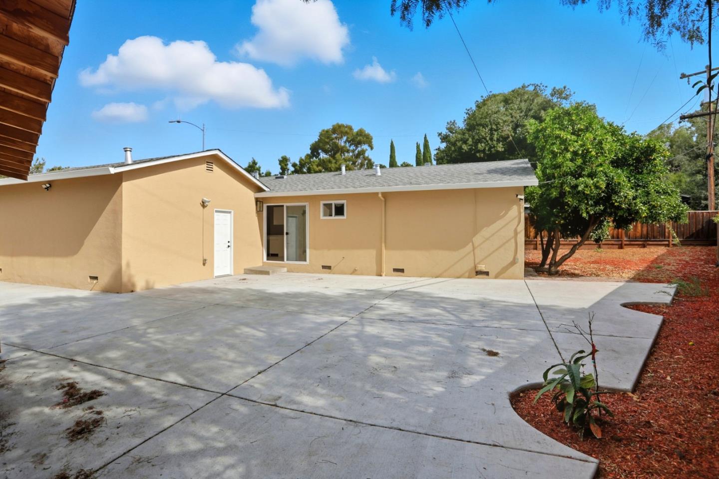 474 Oliver Street Milpitas, CA 95035 - Photo 25 of 27 a front view of a house with a yard and garage