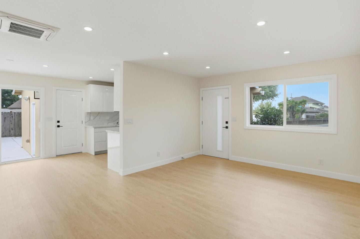 474 Oliver Street Milpitas, CA 95035 - Photo 7 of 27 an empty room with a cabinet and a window