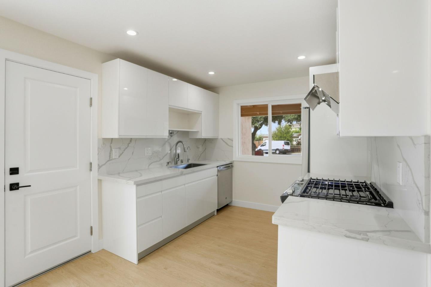 474 Oliver Street Milpitas, CA 95035 - Photo 9 of 27 a kitchen that has a sink and a stove