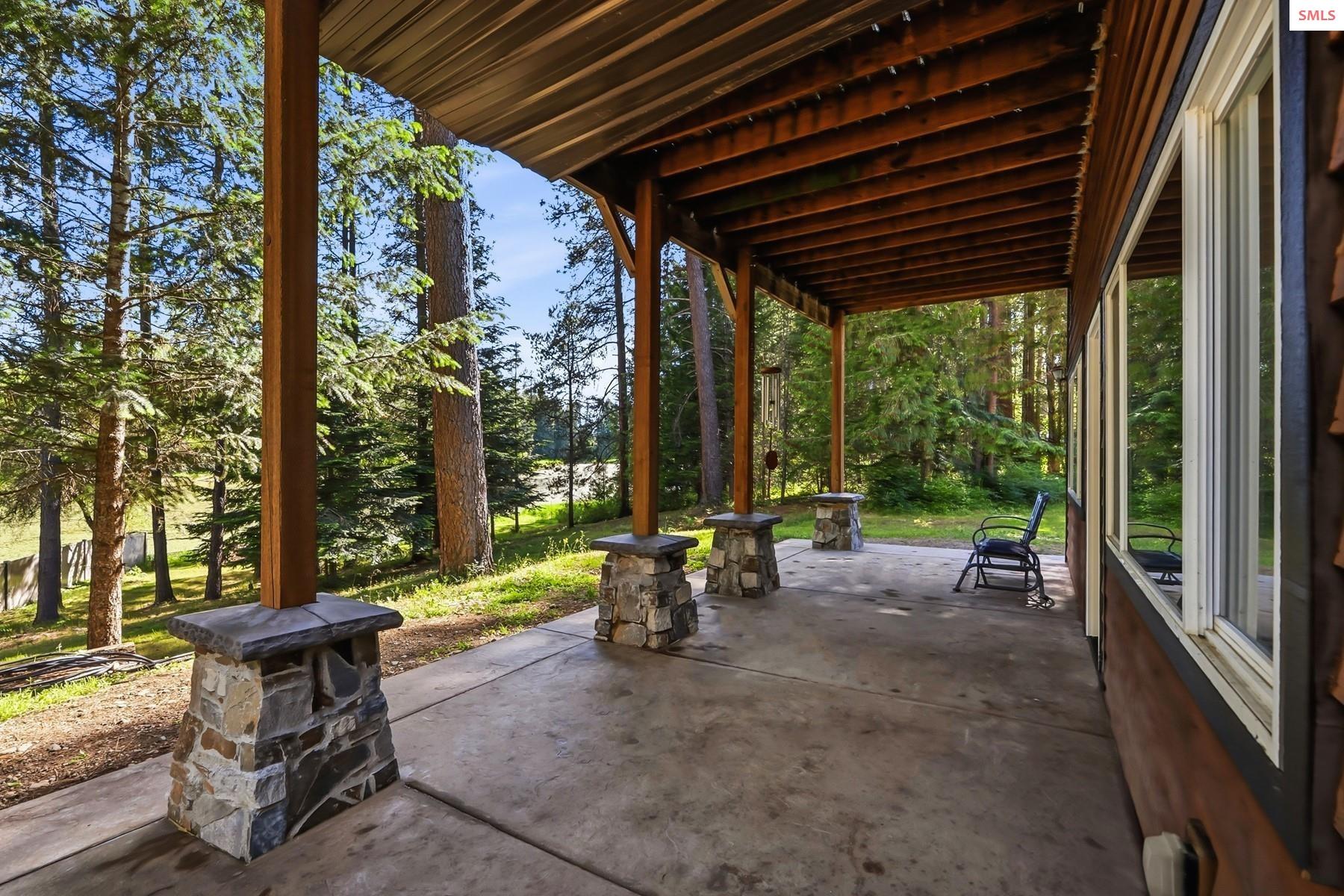 2206 Gypsy Bay Road Sagle, ID 83860 - Photo 14 of 42 Enjoy this back patio space with exposure to North Idaho beauty