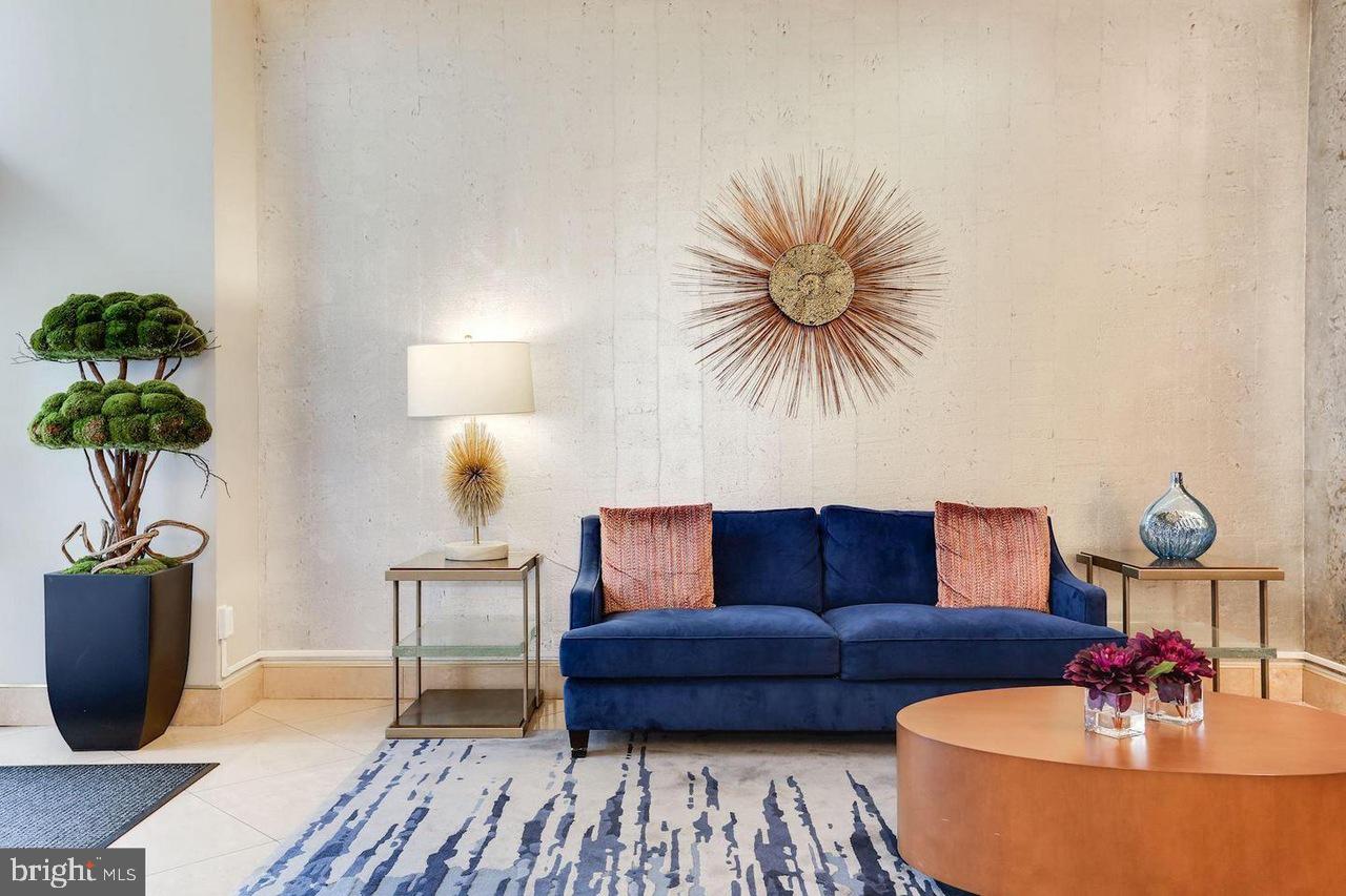 1011 Arlington Boulevard, Unit 930 Arlington, VA 22209 - Photo 27 of 42 a living room with furniture and a potted plant