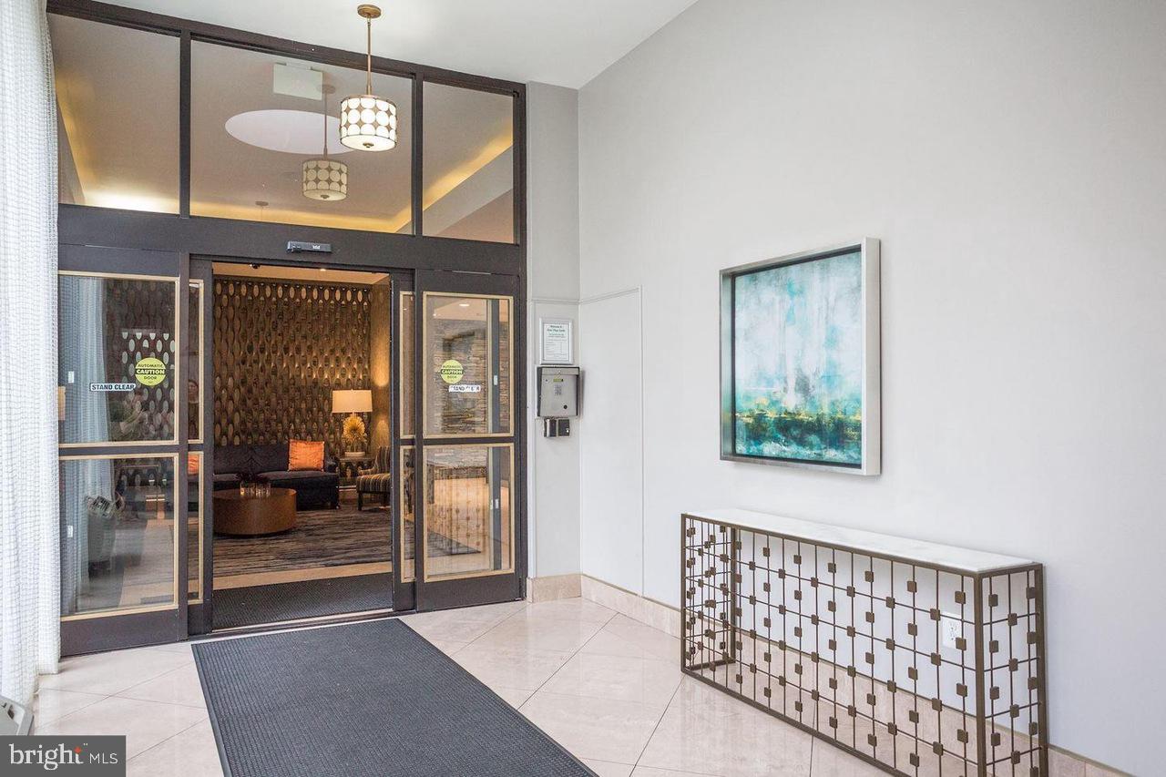 1011 Arlington Boulevard, Unit 930 Arlington, VA 22209 - Photo 29 of 42 a view of a hallway with a furniture
