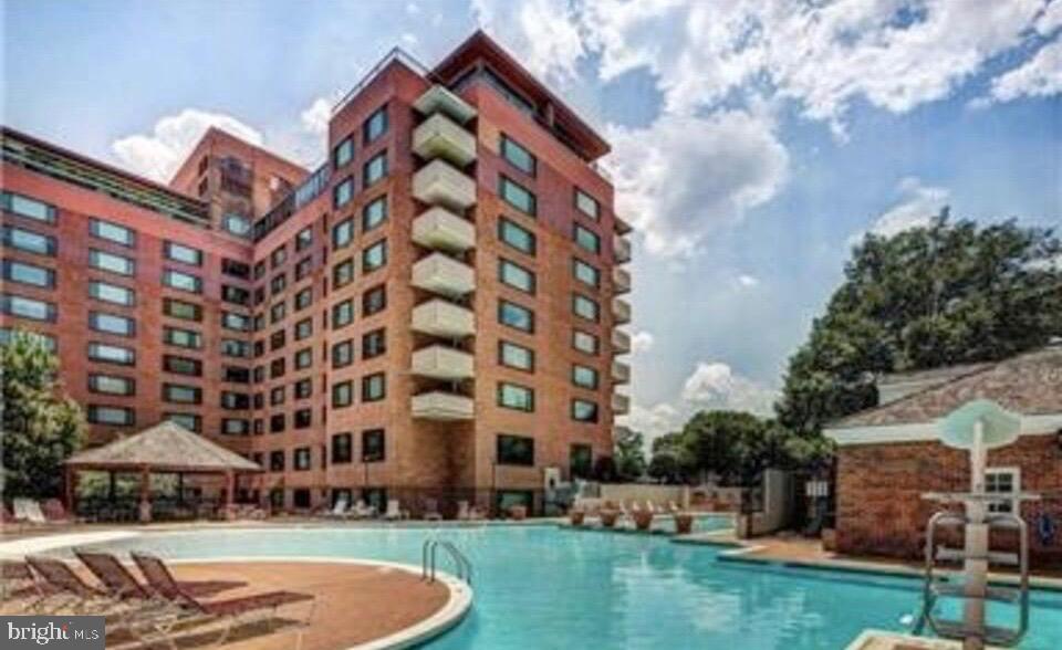 1011 Arlington Boulevard, Unit 930 Arlington, VA 22209 - Photo 31 of 42 a view of building with yard in front of it