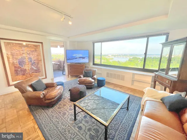 a living room with furniture and a rug