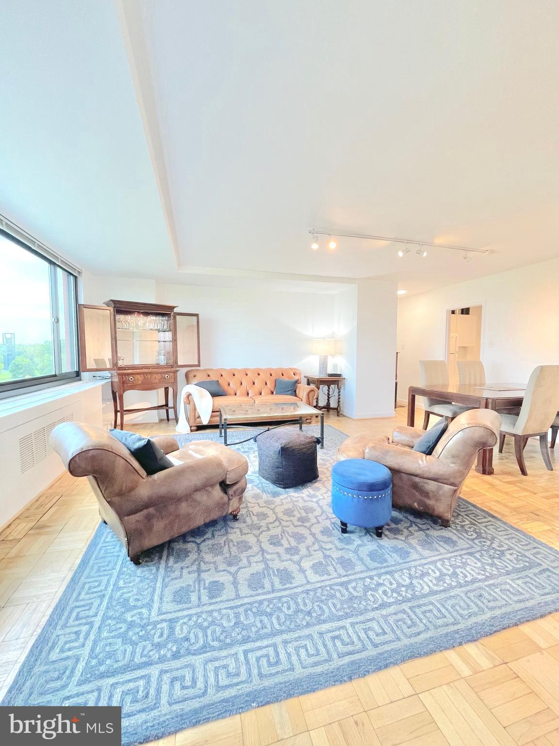 1011 Arlington Boulevard, Unit 930 Arlington, VA 22209 - Photo 8 of 42 a living room with furniture and a large window