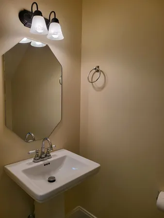 a bathroom with a sink and mirror