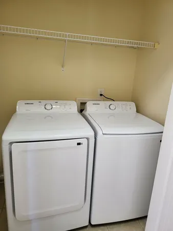 a utility room with dryer and washer