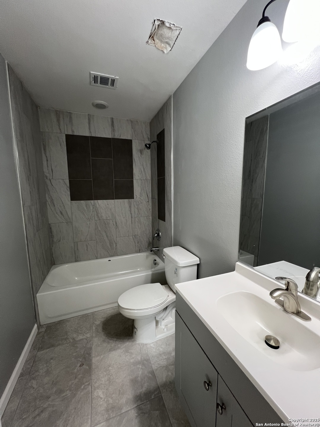 1197 Chisolm Trail Spring Branch, TX 78070 - Photo 9 of 10 a bathroom with a sink and a mirror