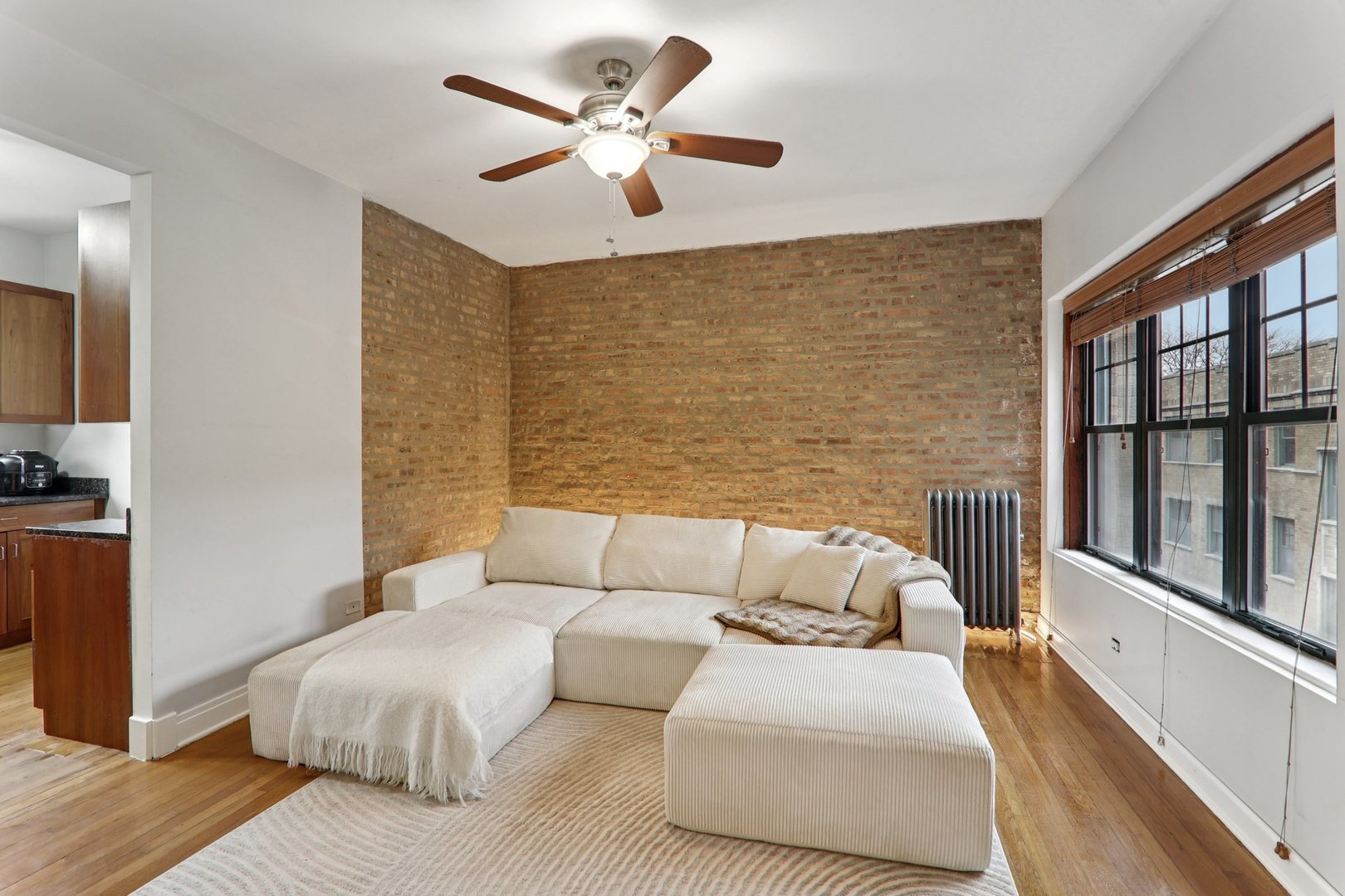 7023.5 North Sheridan Road, Unit 3S Chicago, IL 60626 - Photo 5 of 19 a bedroom with a large bed and a couch