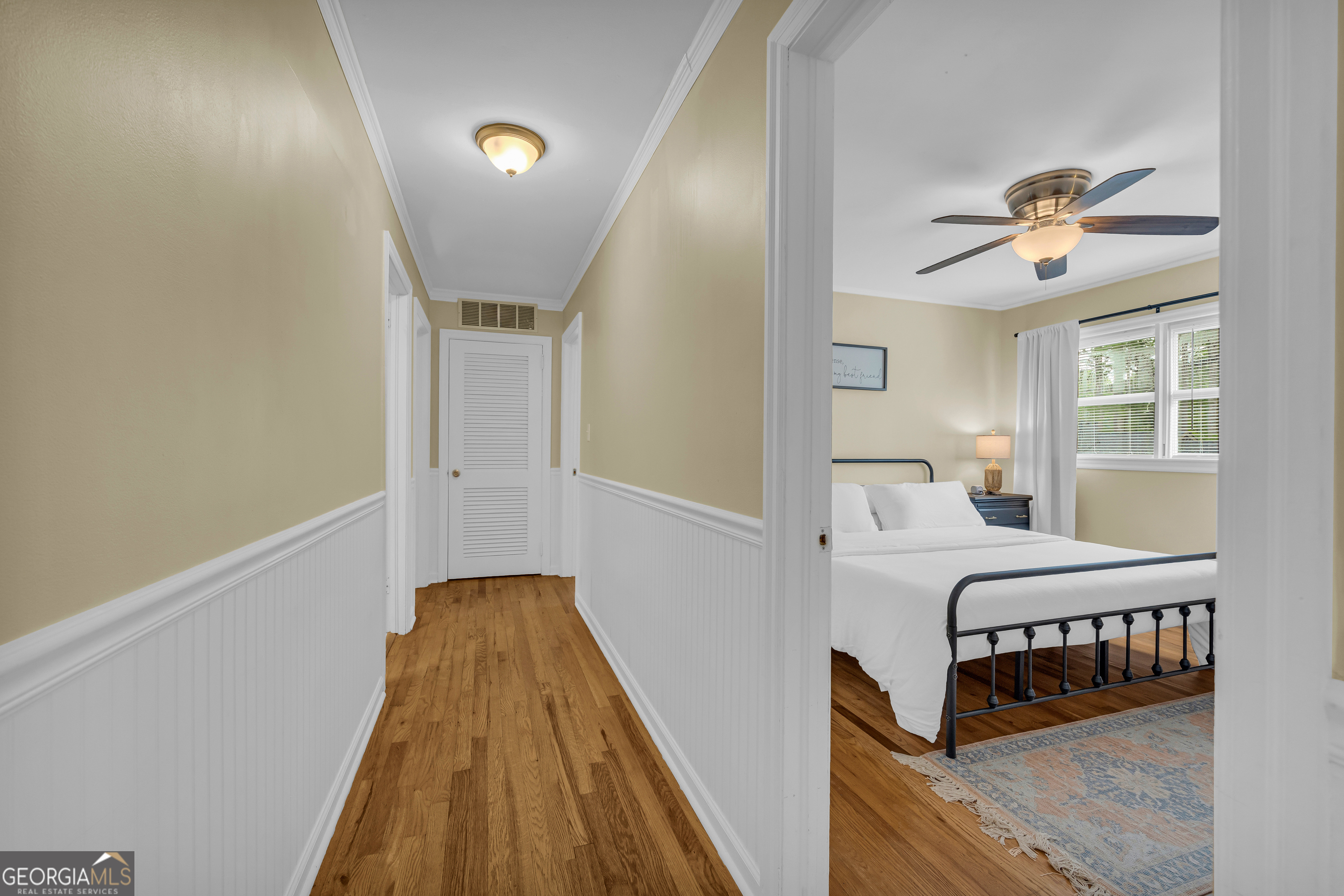 1168 Rosedale Street Toccoa, GA 30577 - Photo 14 of 23 a view of a bedroom with furniture and chandelier fan