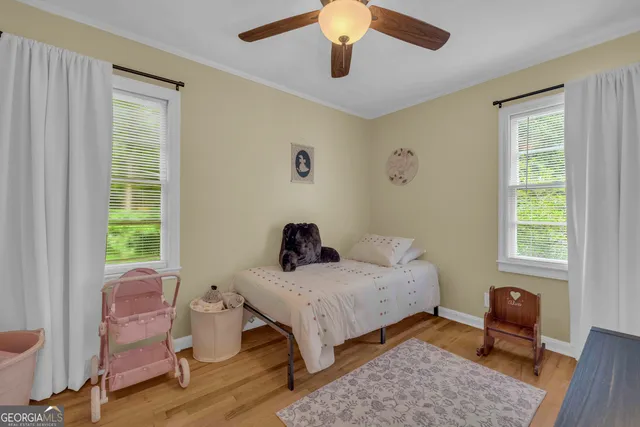 a bedroom with furniture and a window