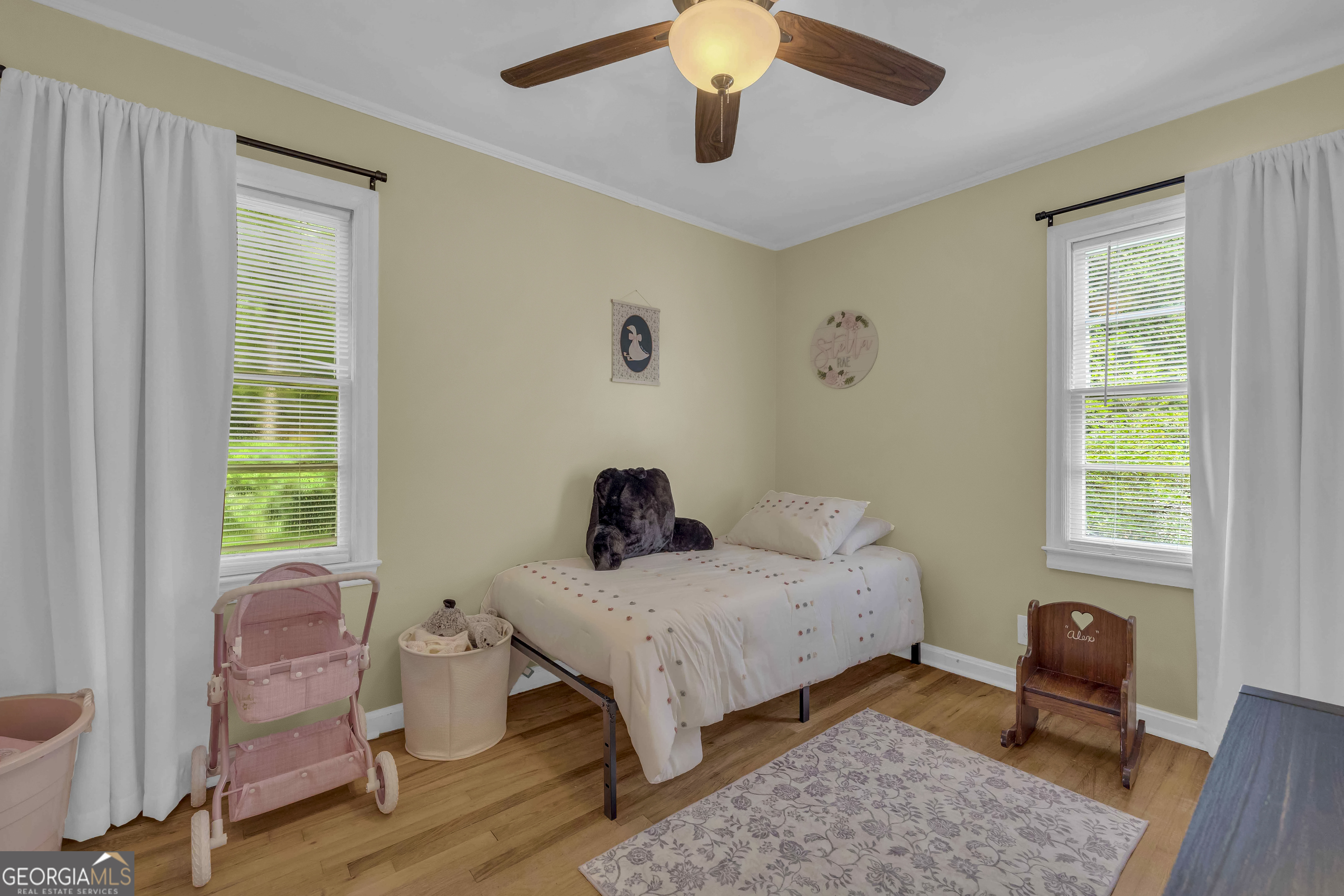 1168 Rosedale Street Toccoa, GA 30577 - Photo 17 of 23 a bedroom with a bed and wooden floor