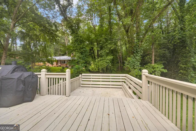 a view of backyard with deck and deck
