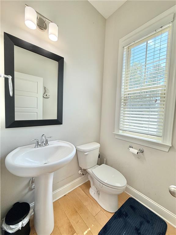 1817 Hislop Lane, Unit 7 Atlanta, GA 30345 - Photo 12 of 32 a bathroom with a toilet a sink and a mirror