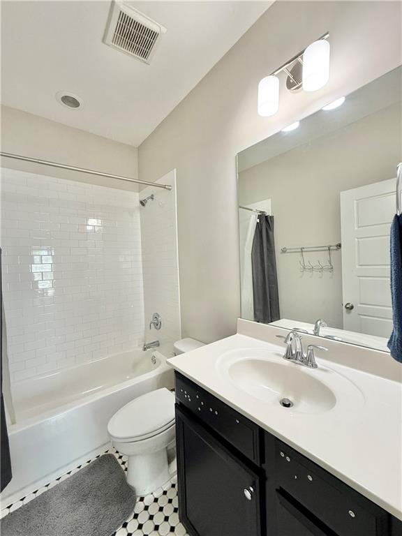 1817 Hislop Lane, Unit 7 Atlanta, GA 30345 - Photo 15 of 32 a bathroom with a sink a toilet and shower