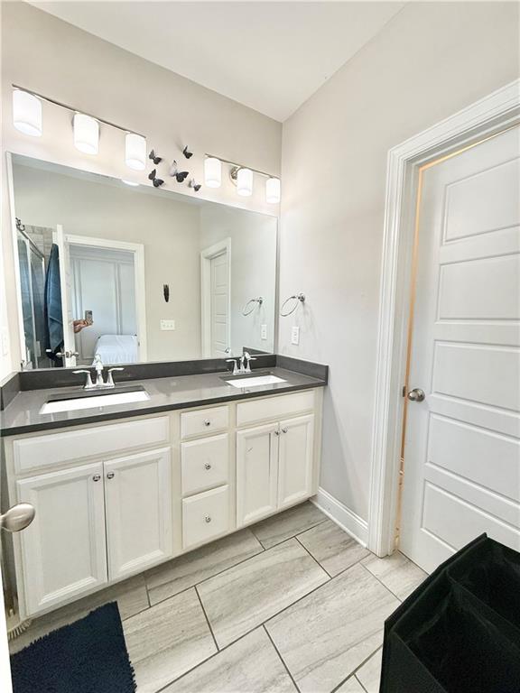 1817 Hislop Lane, Unit 7 Atlanta, GA 30345 - Photo 17 of 32 a spacious bathroom with a granite countertop sink and a mirror